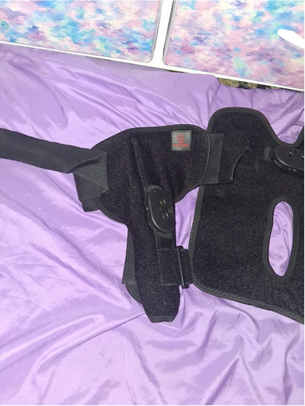 black ProLine Innovations PL-32/33 knee support brace with dual hinges, neo